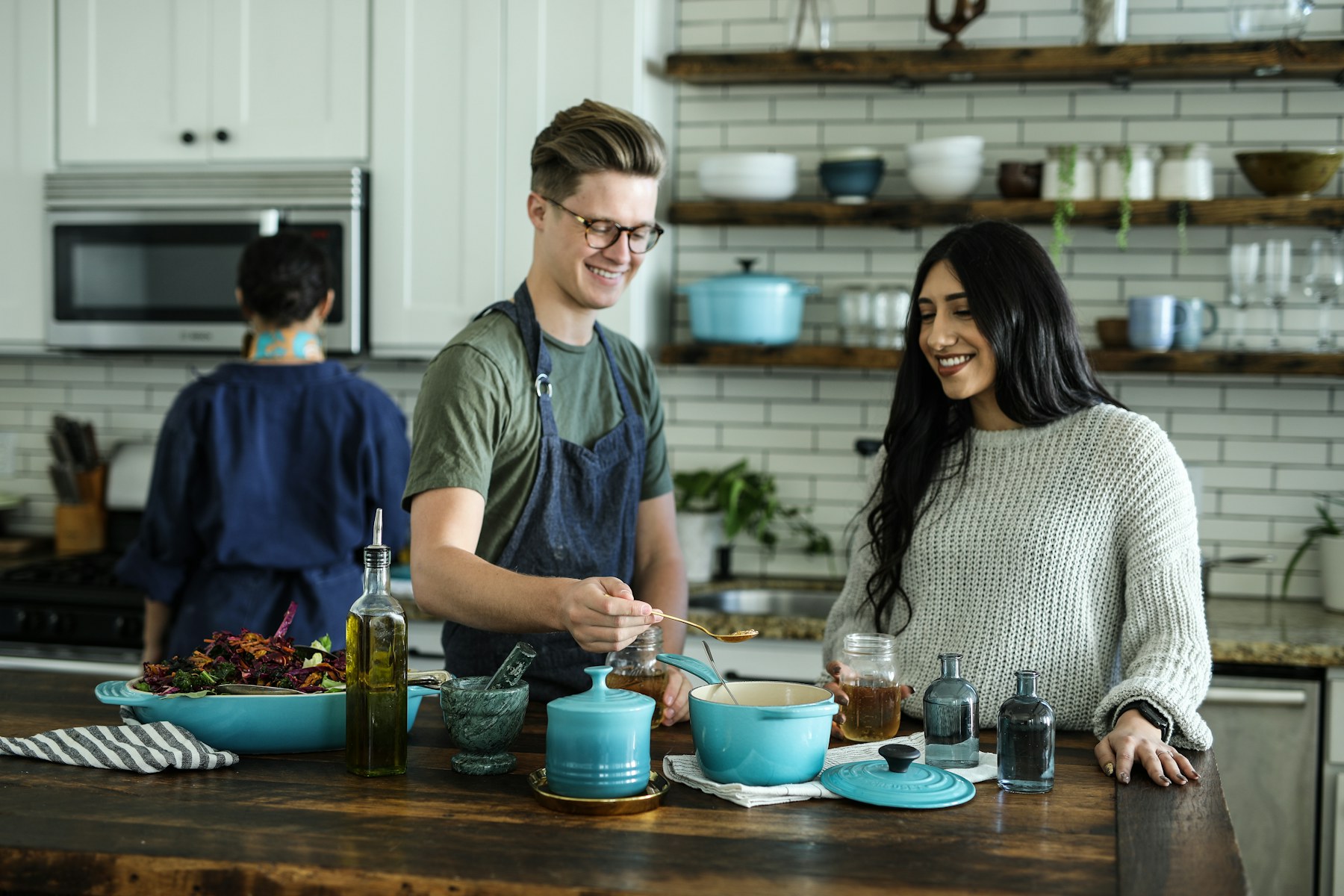 Home cooks preparing a meal together at a real kitchen counter
